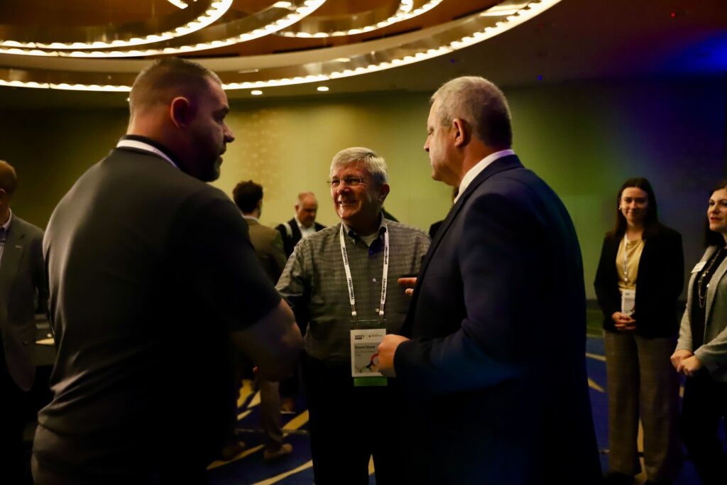 NASID members talking together at the NASID conference.